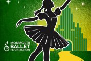 dorothy ballerina posing along yellow brick road with emerald city background